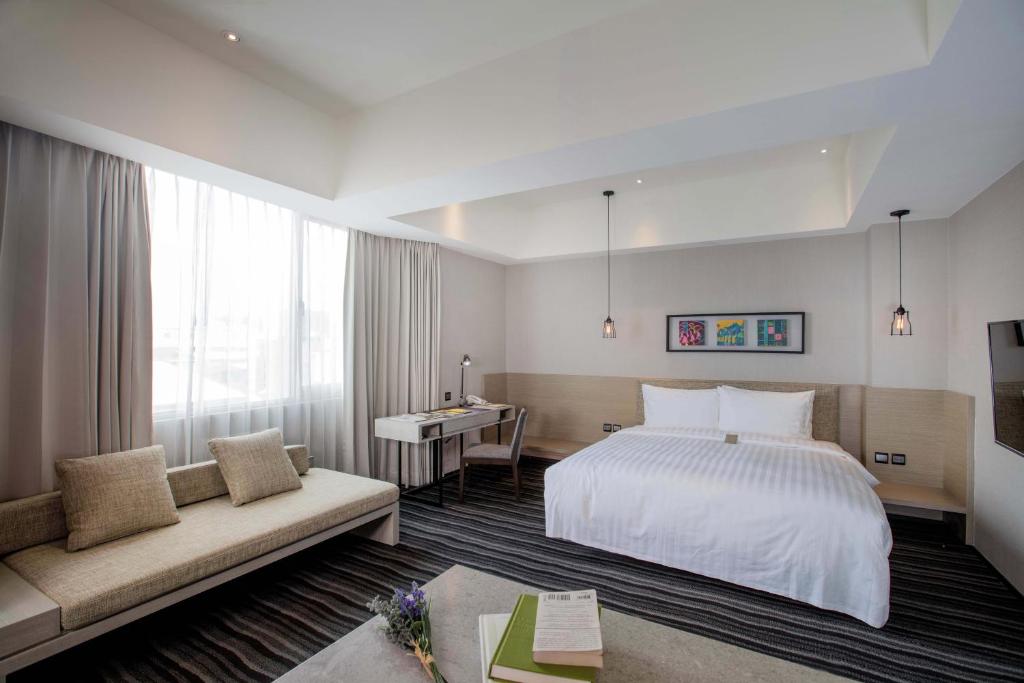 Postel nebo postele na pokoji v ubytování Changyu Hotel