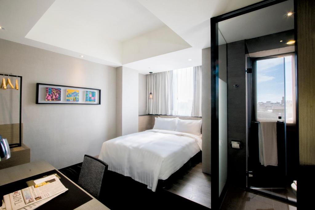 Postel nebo postele na pokoji v ubytování Changyu Hotel