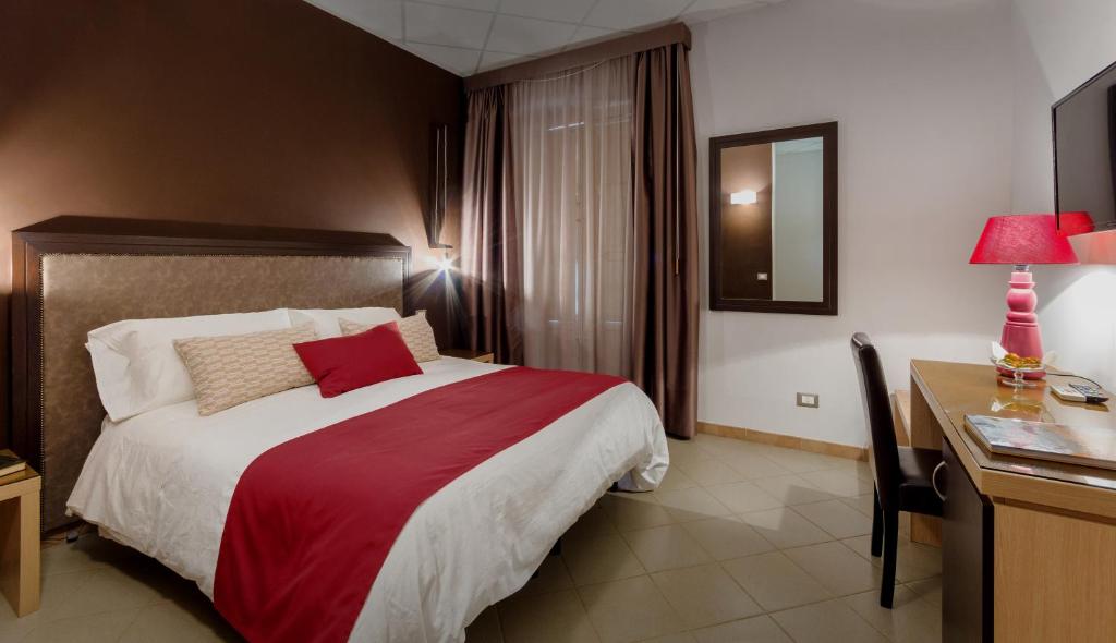 Postel nebo postele na pokoji v ubytování Hotel Moderno