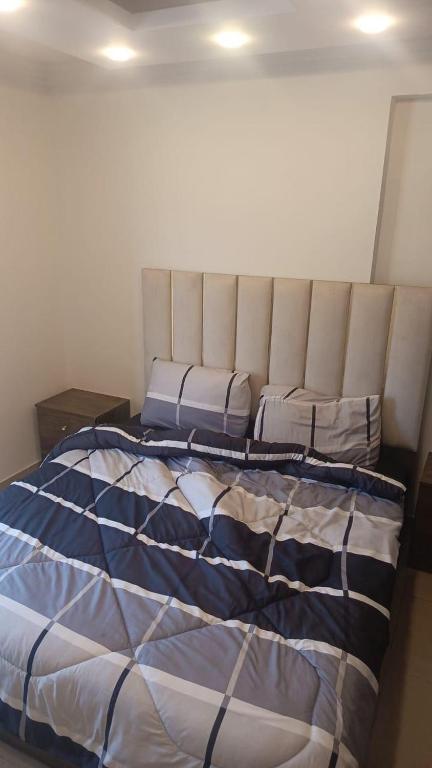 Ένα ή περισσότερα κρεβάτια σε δωμάτιο στο lNTERCoNTlNENTALALALx