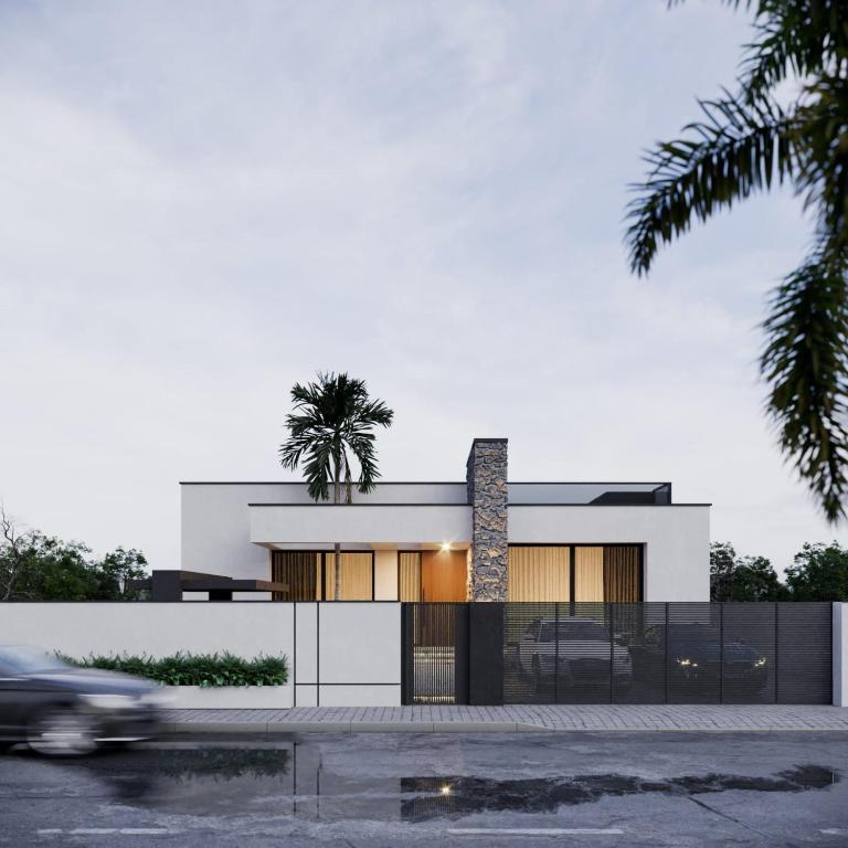 Ḩilfにあるمنزل للإيجار اليوميのヤシの木が立つ建物