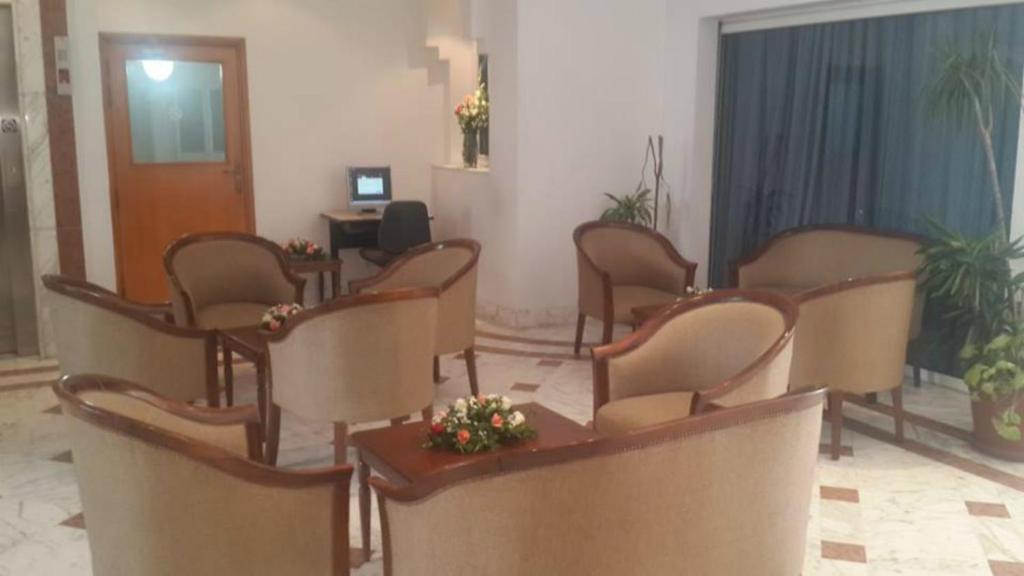 TV a/nebo společenská místnost v ubytování Ariha Hotel