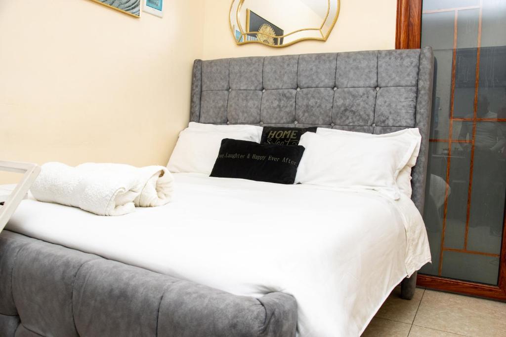 Ένα ή περισσότερα κρεβάτια σε δωμάτιο στο Beauty & Bliss Homes