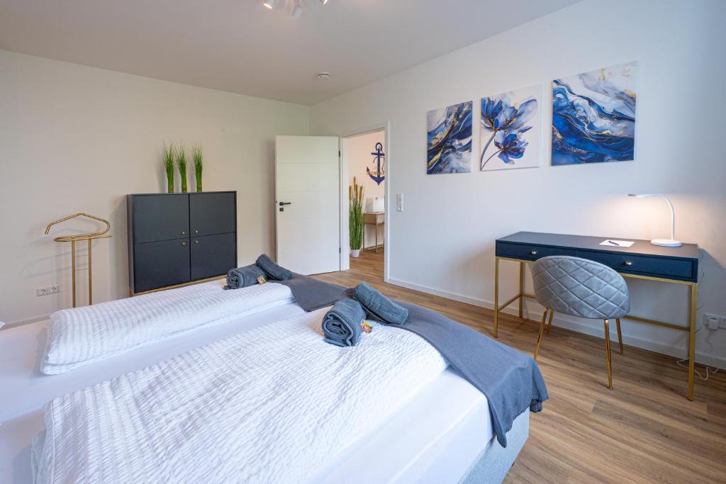 Ένα ή περισσότερα κρεβάτια σε δωμάτιο στο Skipper's Deck - Neues zentrales Apartment in Deichnähe von STAY YOUR WAY