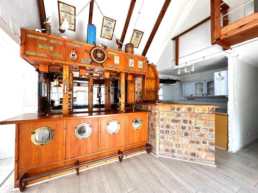 a room with a bunch of suitcases on a counter at Harbor View Cottage in Hout Bay