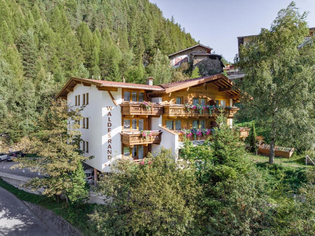 a building on the side of a mountain at Appartements Waldesrand in Sölden