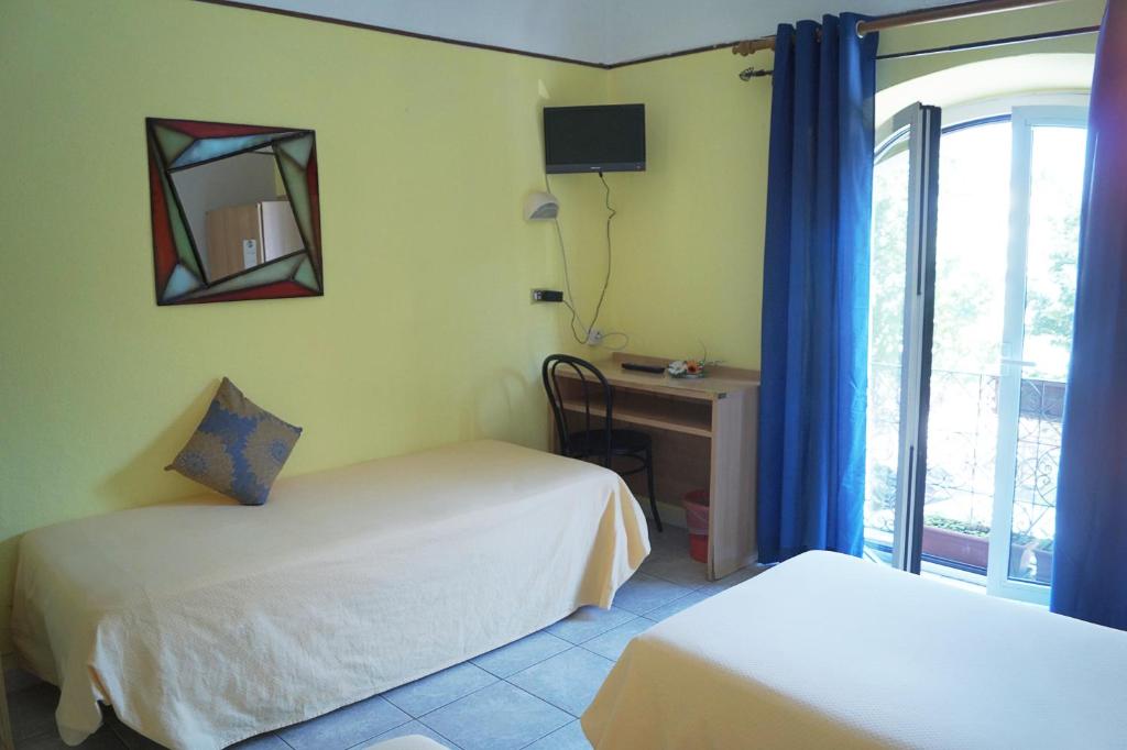 Postel nebo postele na pokoji v ubytování Hotel Stazione