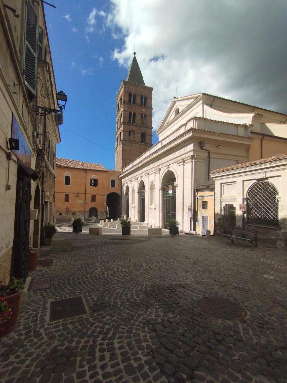 a building with a clock tower in the distance at Antica Tibur in Tivoli