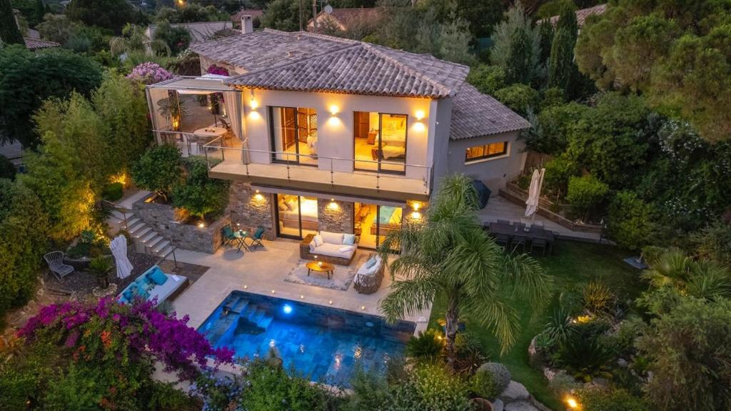 an aerial view of a house with a swimming pool at Villa Carlina - Saint Tropez in Sainte-Maxime