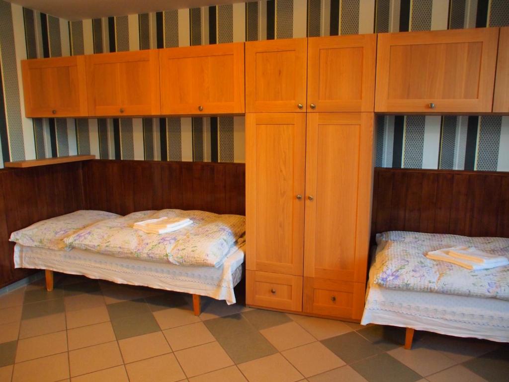 Postel nebo postele na pokoji v ubytování Apartmány pod Kozákovem