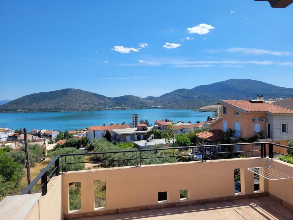 a view of the water from the balcony of a house at Lovely house with amazing views in Chalkida