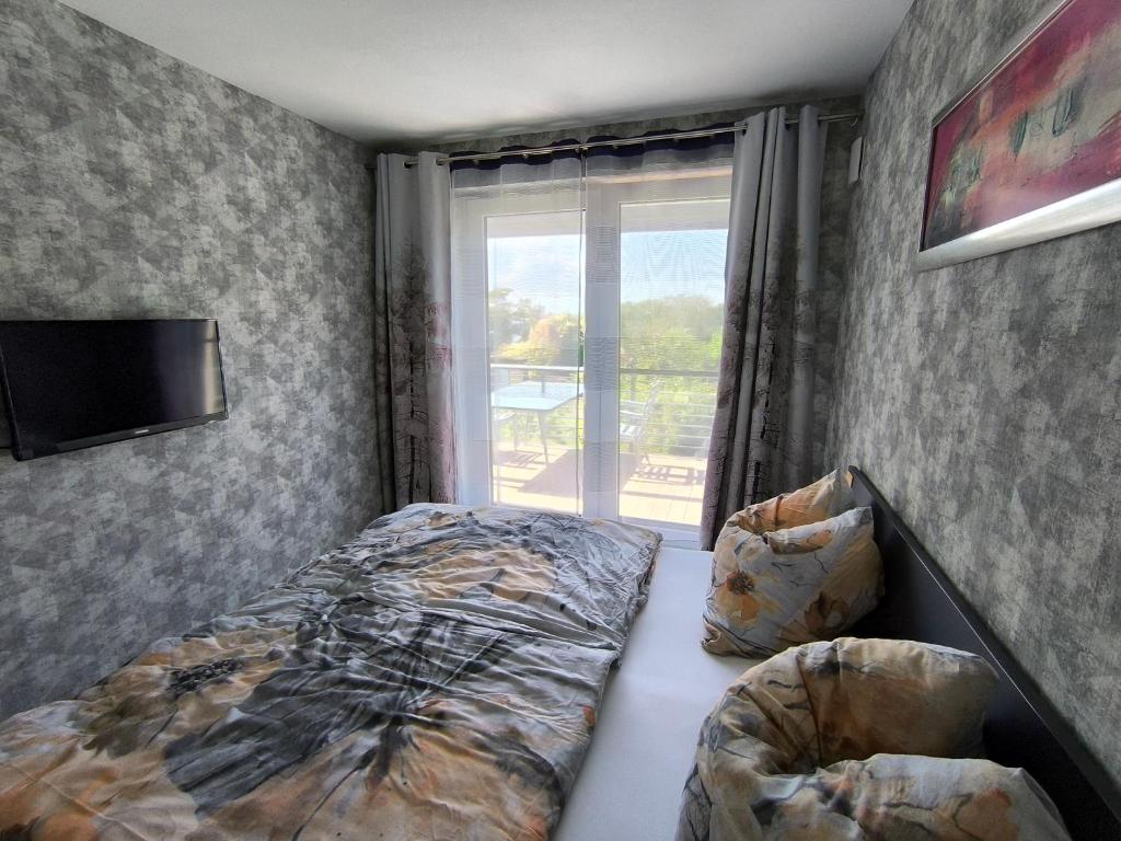 Posteľ alebo postele v izbe v ubytovaní Ferienwohnung Fährblick OG