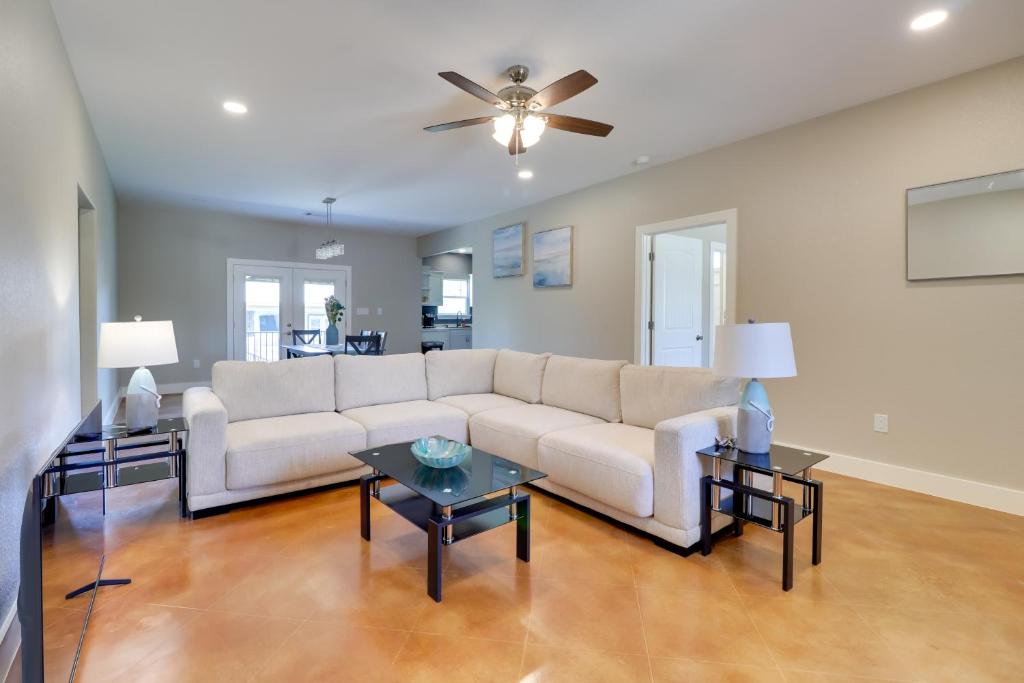 a living room with a white couch and tables at Quiet Hill Country Home 1 Mi to Lake LBJ Access! in Granite Shoals