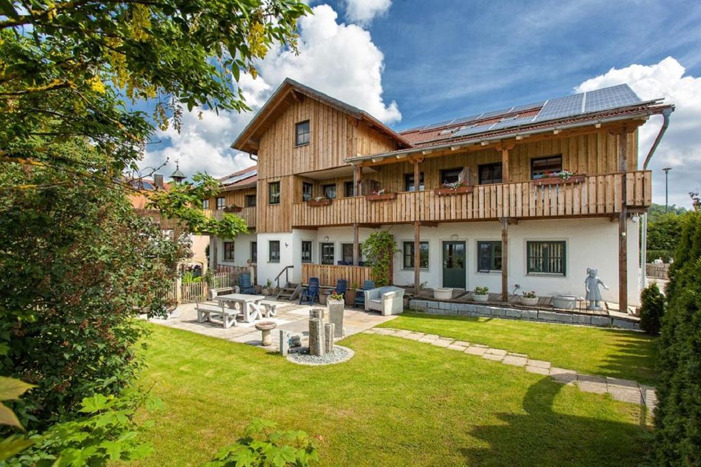 a large house with a lawn in front of it at Am Rückerlhof in Waldmünchen