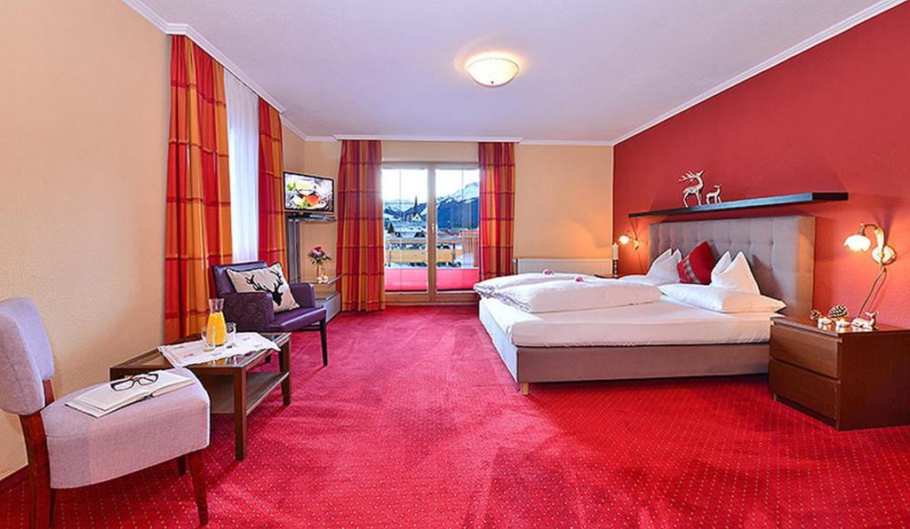 Postel nebo postele na pokoji v ubytování Hotel Jagdhof