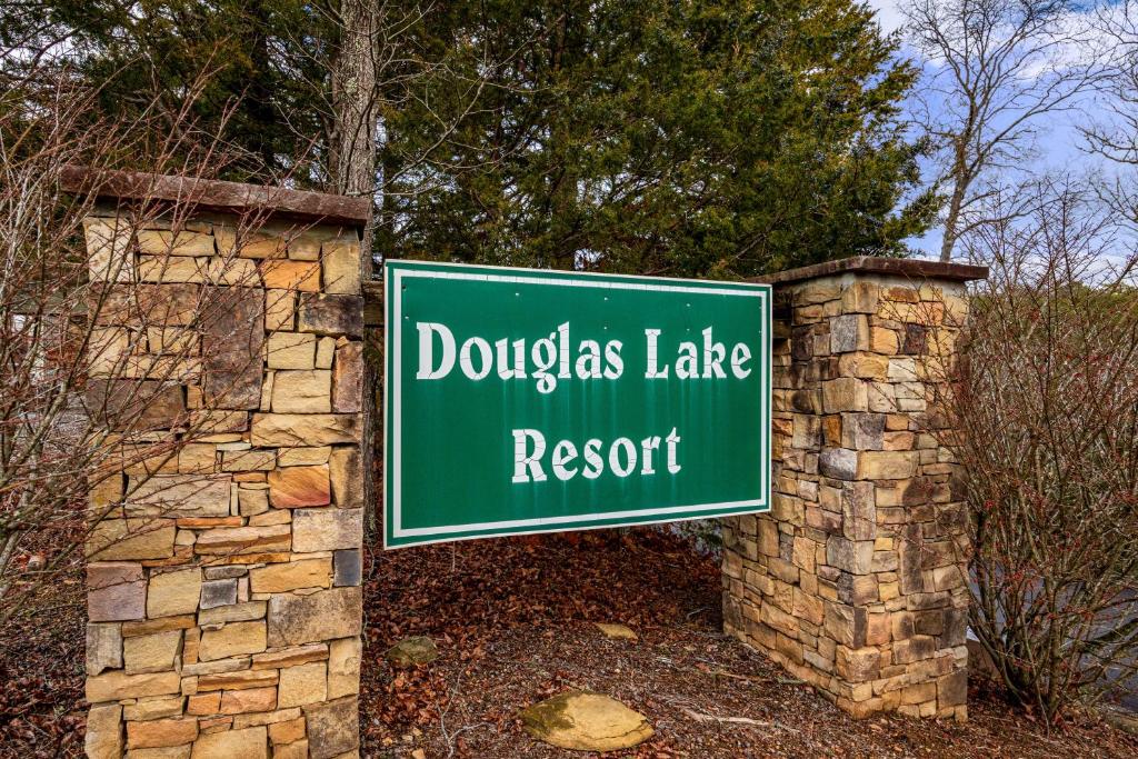 a sign for the doolinias lakerence resort at Grand View at Douglas Lake by American Patriot Getaways in Walnut Grove