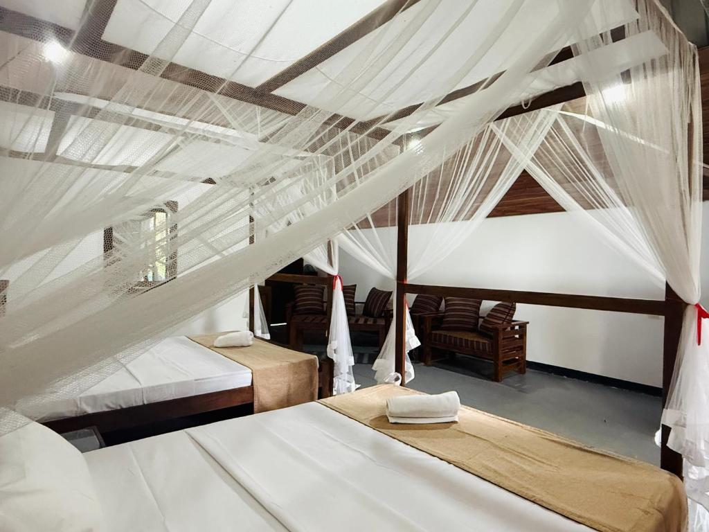 Postel nebo postele na pokoji v ubytování Zora Resort