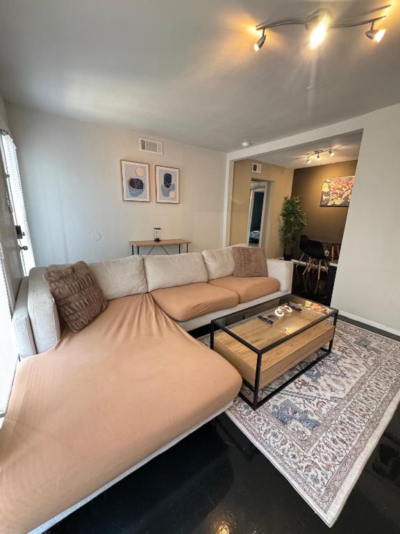 a living room with a couch and a coffee table at 5 STATE FAIR l DT Dallas l FIFA READY l Staycation 1Bd1Ba in Dallas