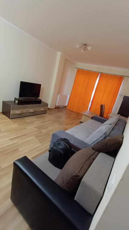 a room with two beds and a television in it at Hunyadi Luxury Ciresica in Sibiu