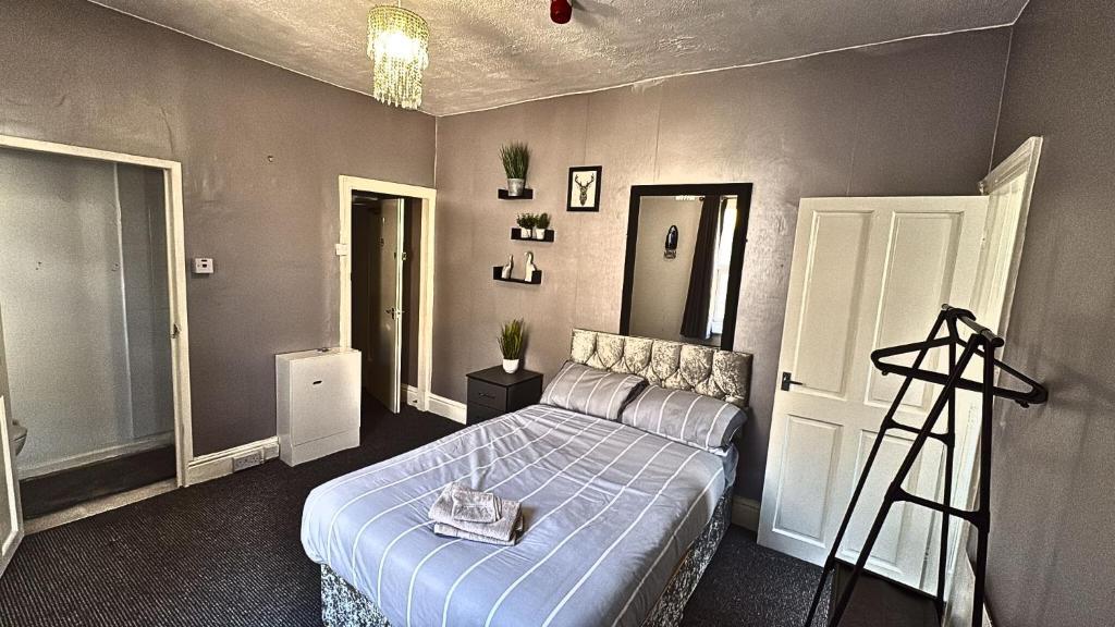 a bedroom with a bed and a ladder in it at Blackpool Pleasure Beach whole Holiday Home! in Blackpool