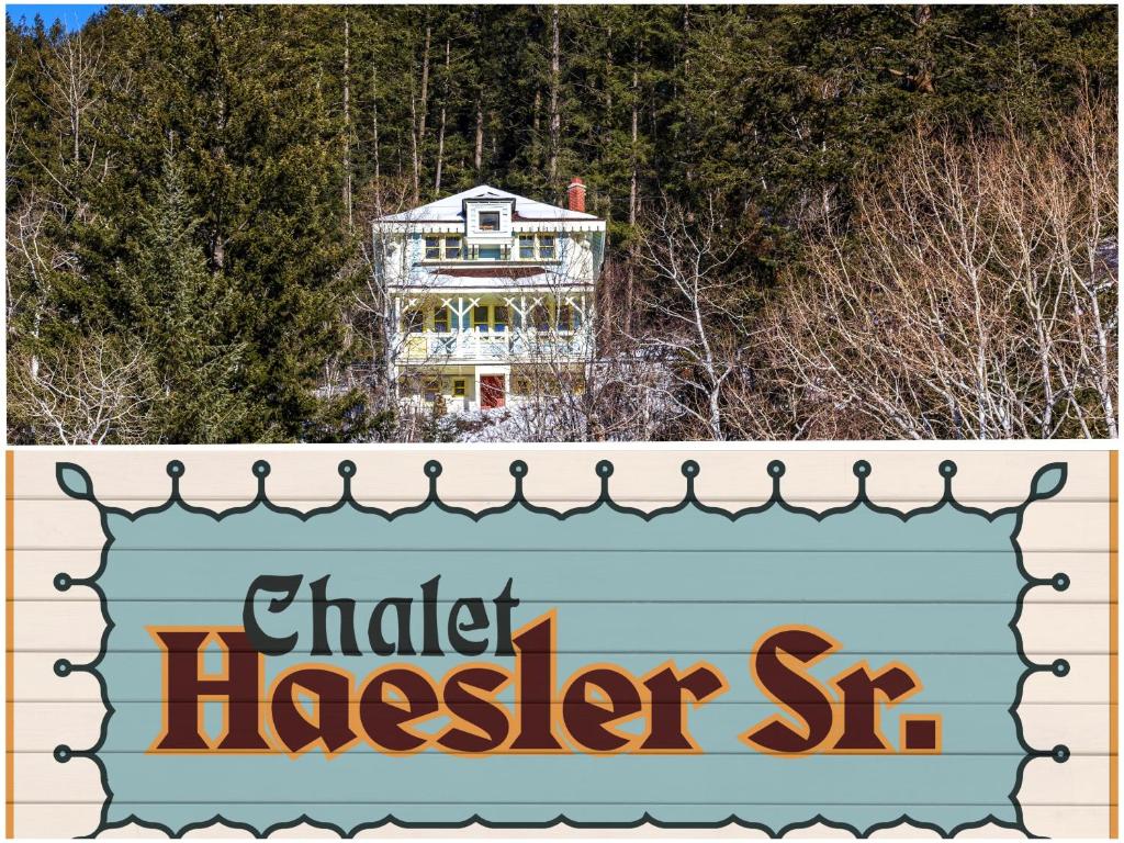 a sign with a house in the background at Chalet Haesler Sr - Edelweiss Village in Golden