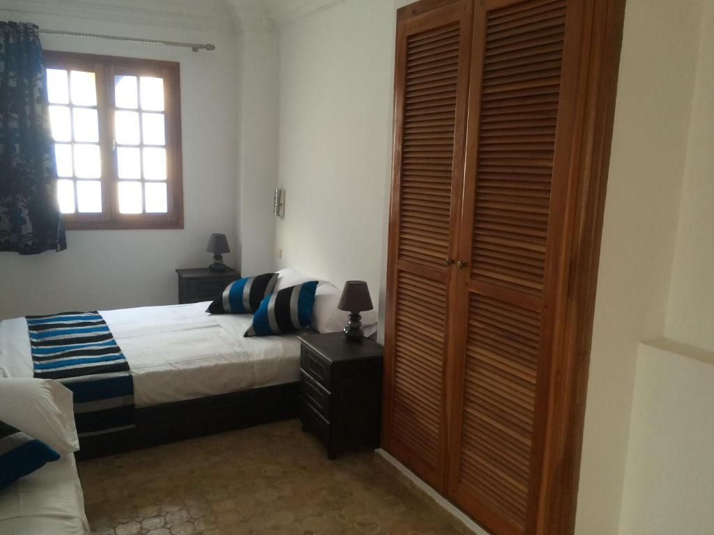 Uma cama ou camas num quarto em Riad Aicha