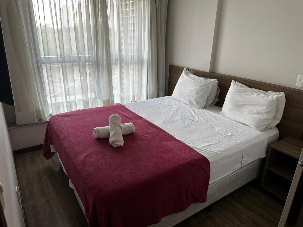 En eller flere senge i et værelse på Flat - Barra Olímpica