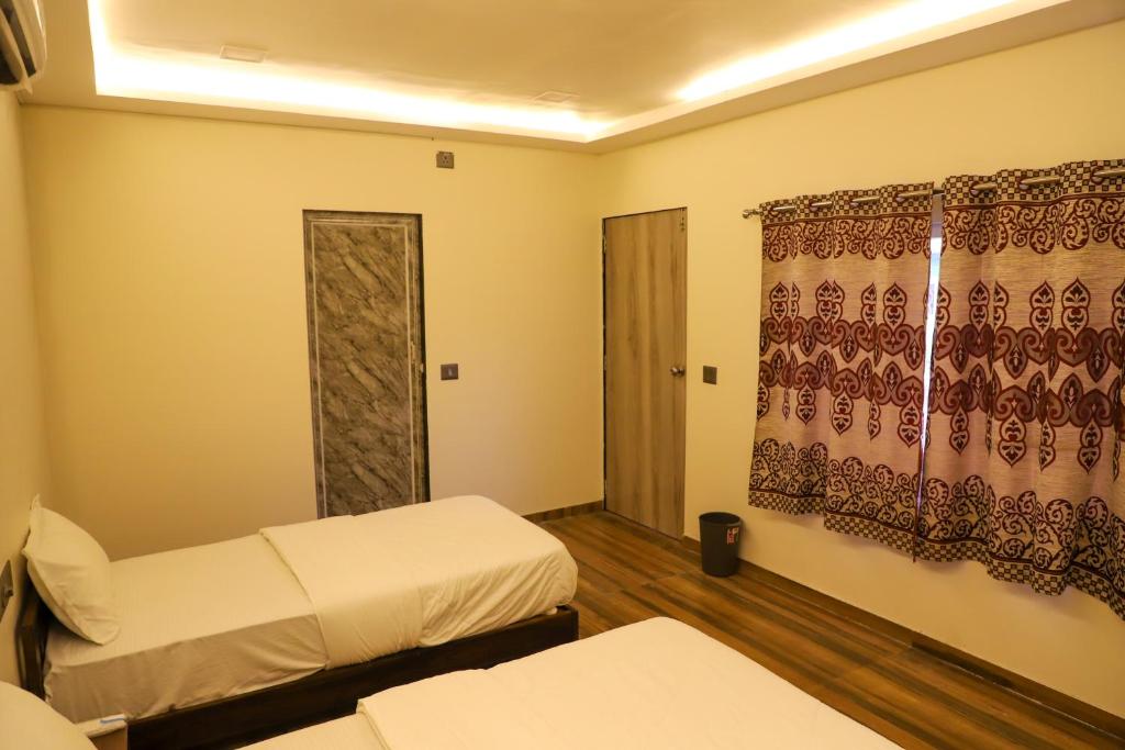 Ένα ή περισσότερα κρεβάτια σε δωμάτιο στο The Moonland Resort