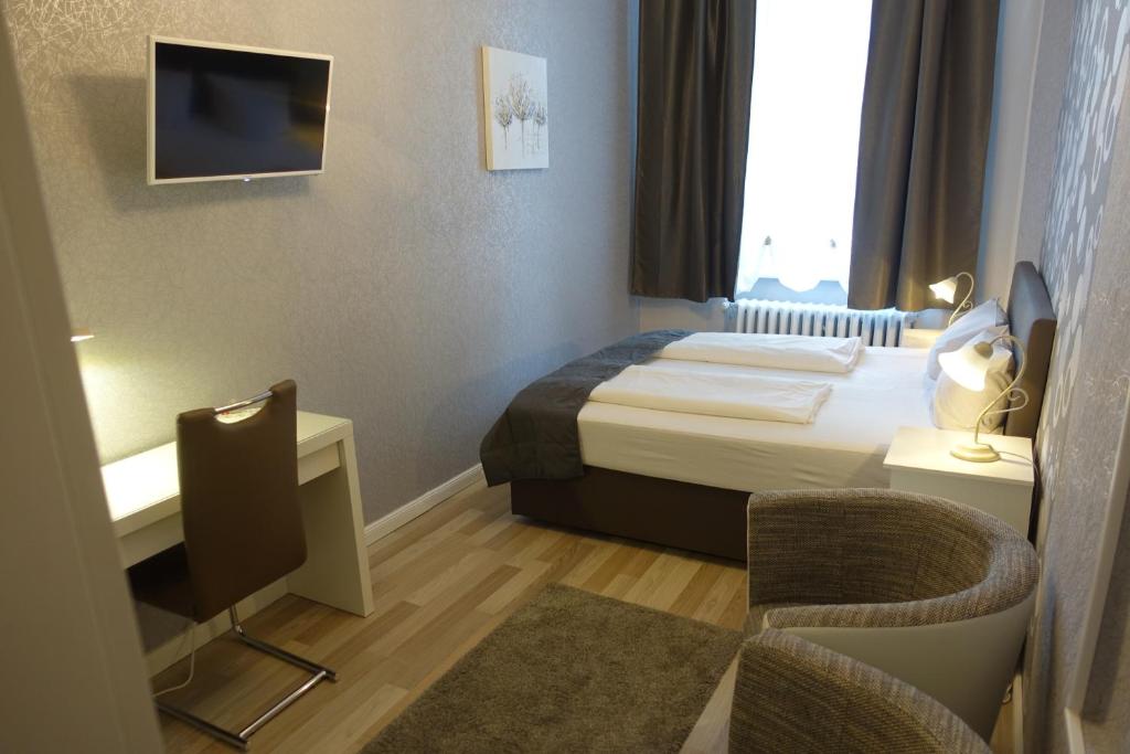 Postel nebo postele na pokoji v ubytování Hotel Villa Konstanz