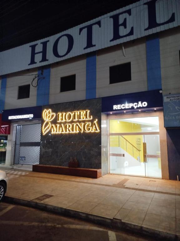 a hotel amaminota sign on the front of a building at Hotel Maringá in Juara
