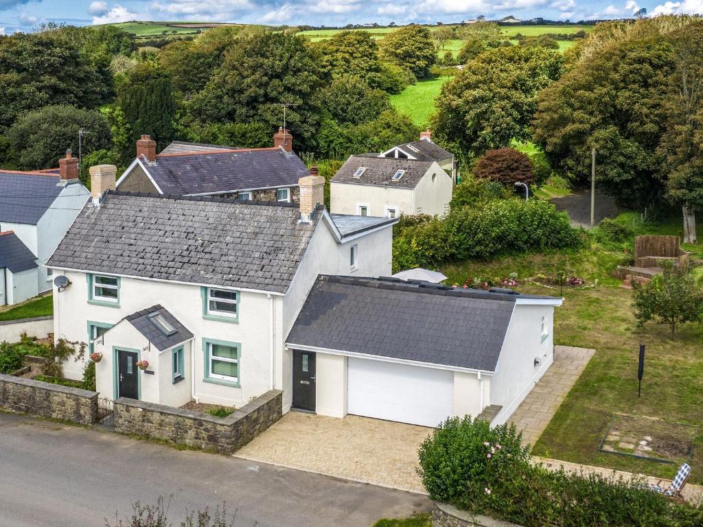 an aerial view of a white house at Bryn Olwyn in Little Newcastle