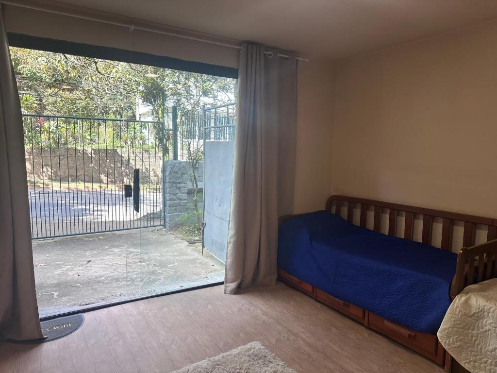 Ένα ή περισσότερα κρεβάτια σε δωμάτιο στο Oceana Suites Petropolis