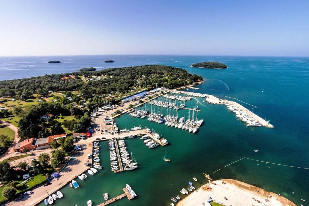 an aerial view of a marina with boats in the water at Apartments in Funtana - Istrien 53439 in Funtana