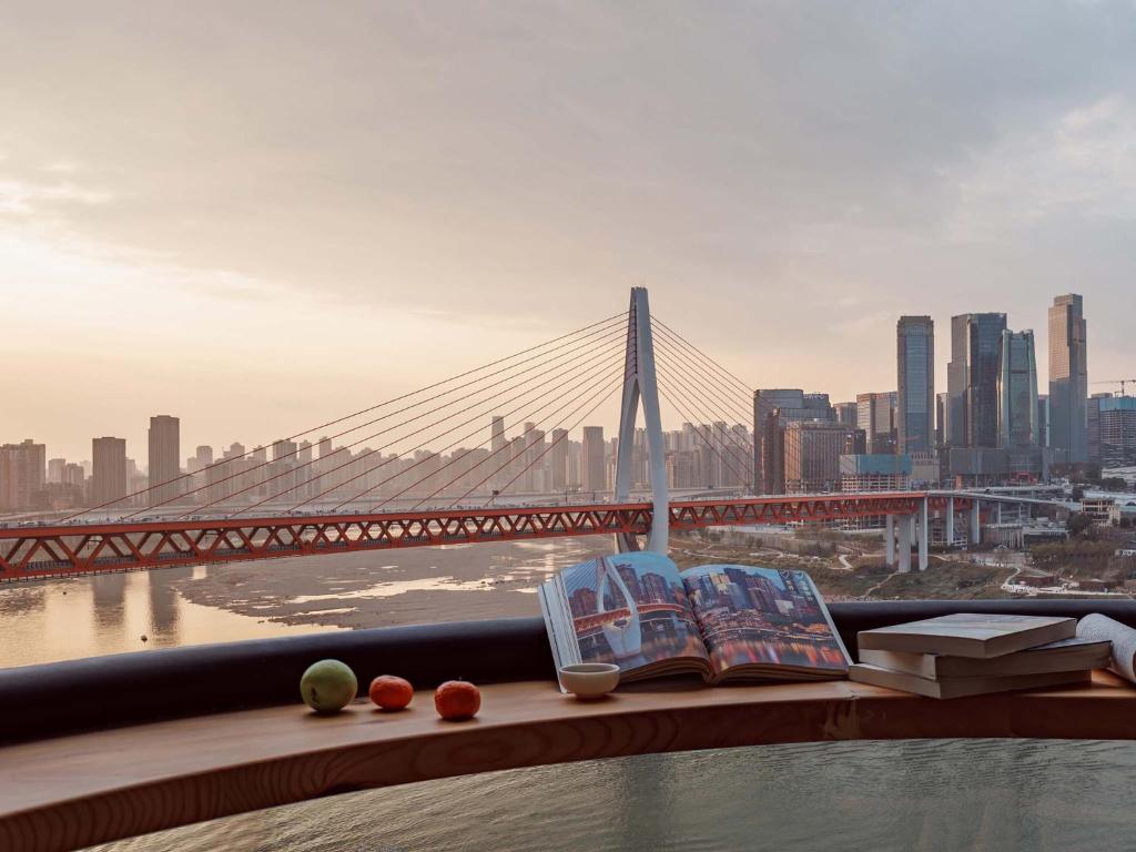 a view of a bridge with books on a ledge at Boys2men in Chongqing