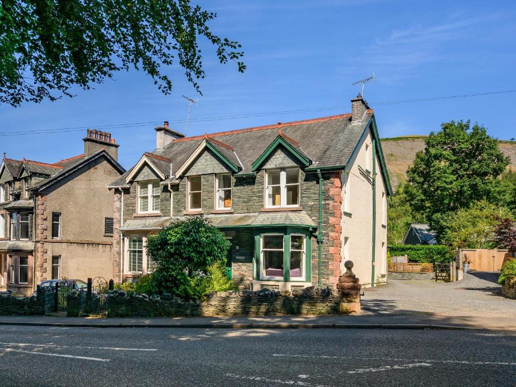 a large brick house on the side of a street at Greenbank in Keswick