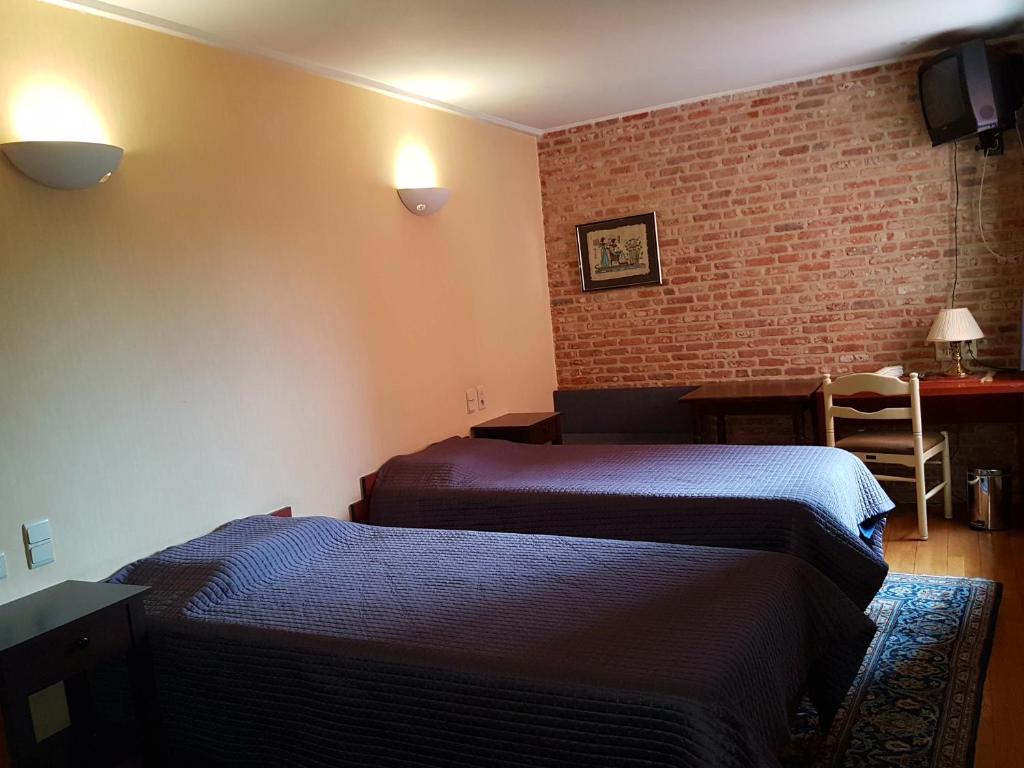 Postel nebo postele na pokoji v ubytování Hotel La Barakka