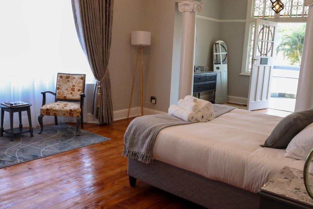 En eller flere senge i et værelse på The Essenwood Collection