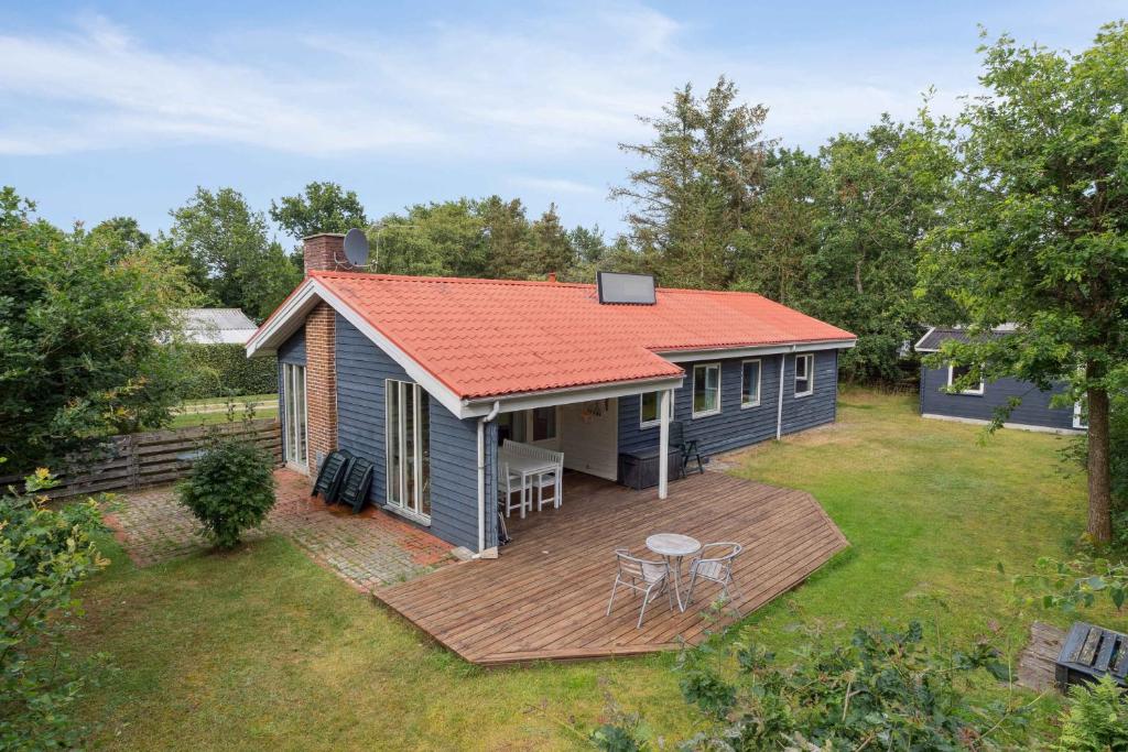 an aerial view of a small house with a deck at Cozy Holiday Home Close To The Beach in Thyholm