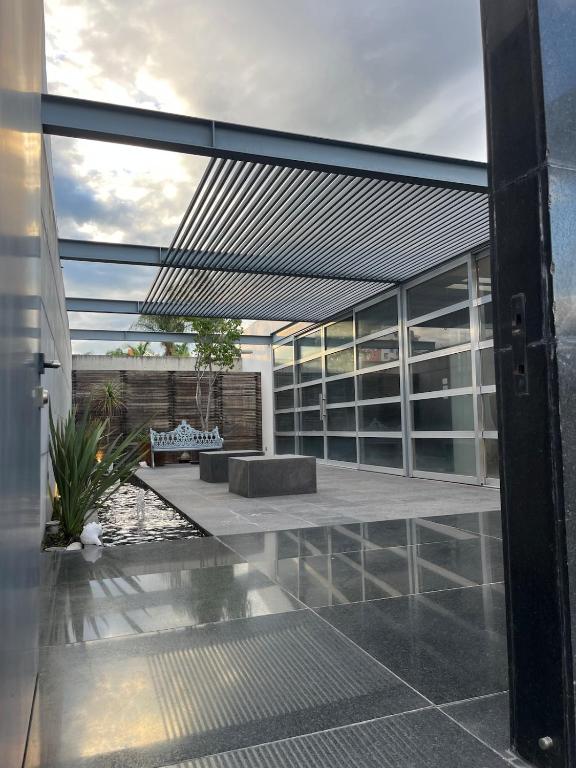an open door of a house with a patio at Casa Dodi Loft in Juriquilla Design oasis in Juriquilla