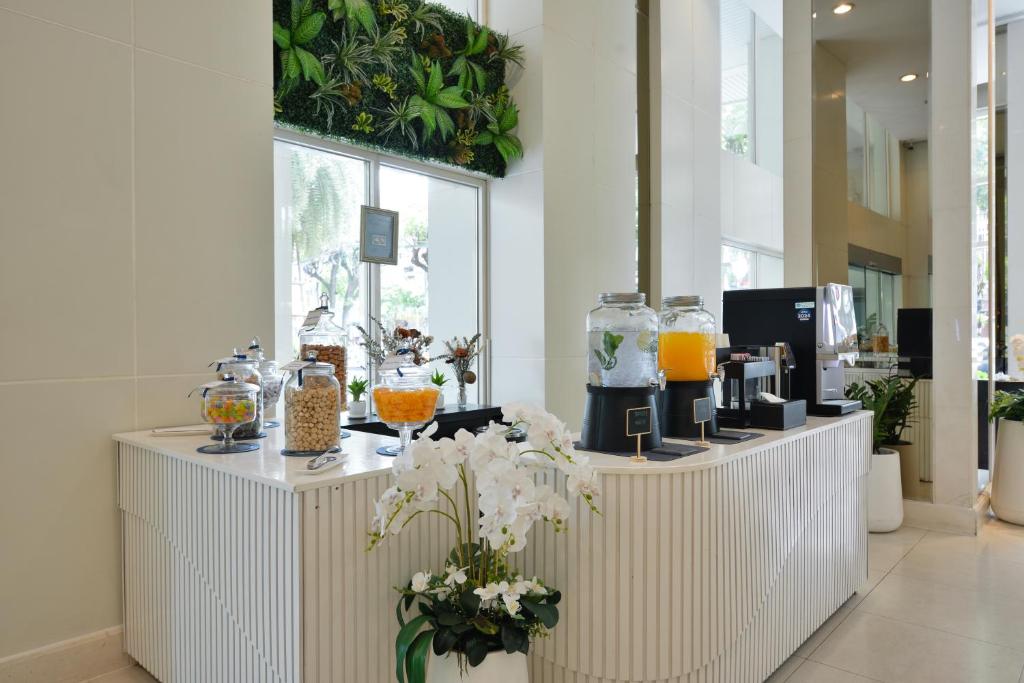 A bright lobby refreshment counter beside tall windows.