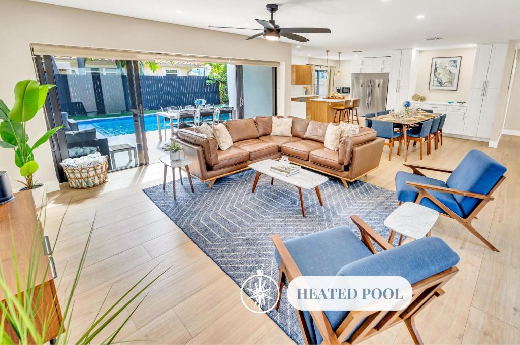 a living room with a couch and chairs at Open Concept Bungalow Beach Proximity Lush Neighborhood Pearl Key in Fort Lauderdale