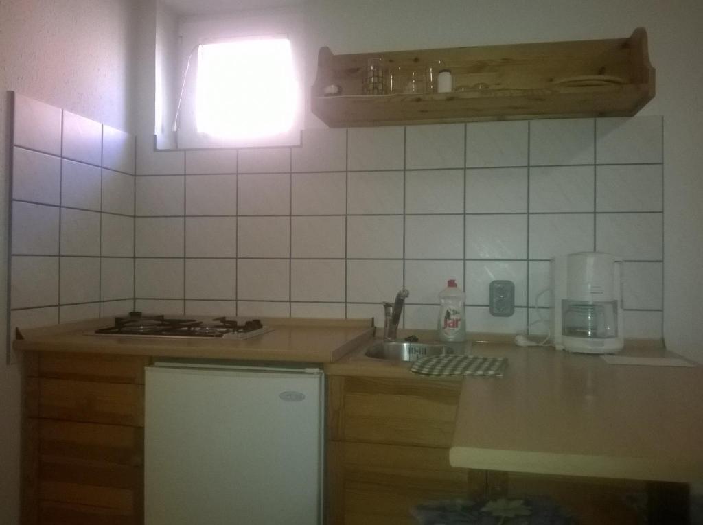 Kuchyňa alebo kuchynka v ubytovaní Apartman Németh