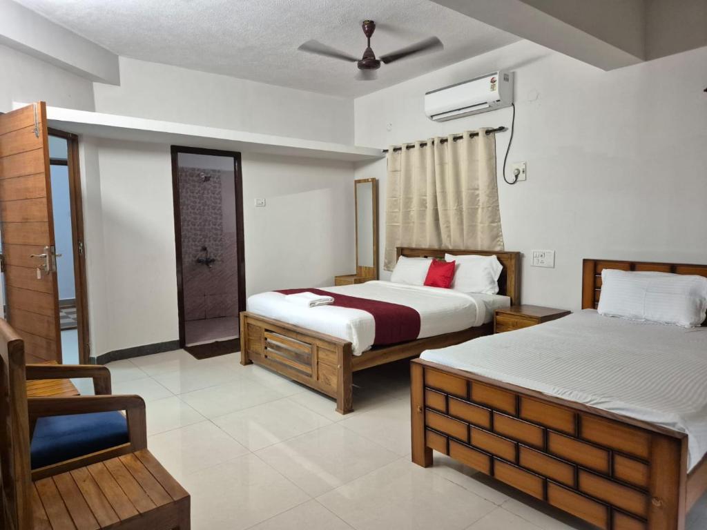 Postel nebo postele na pokoji v ubytování Rivera Nest Serviced Apartment