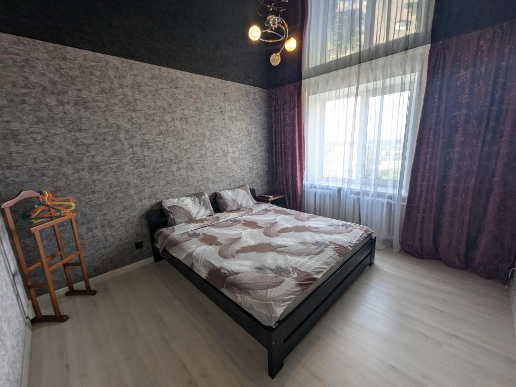 Кровать или кровати в номере 2 кімнатна Квартира