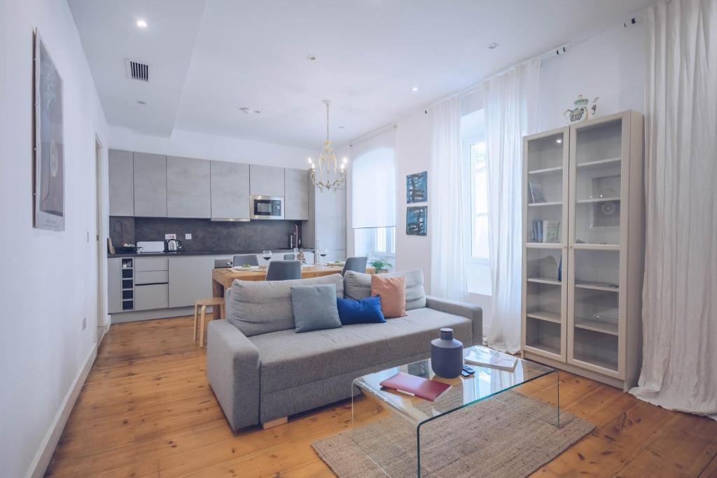 a living room with a couch and a table at Eclectic 2BR with shared terrace perfect getaway in Gibraltar