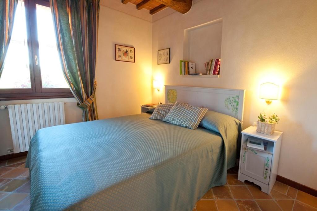 Postel nebo postele na pokoji v ubytování Podere Chiaromonte