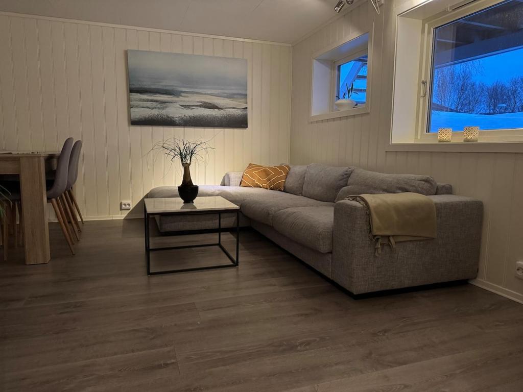 a living room with a couch and a table at Apartment in Tromsø in Tromsø