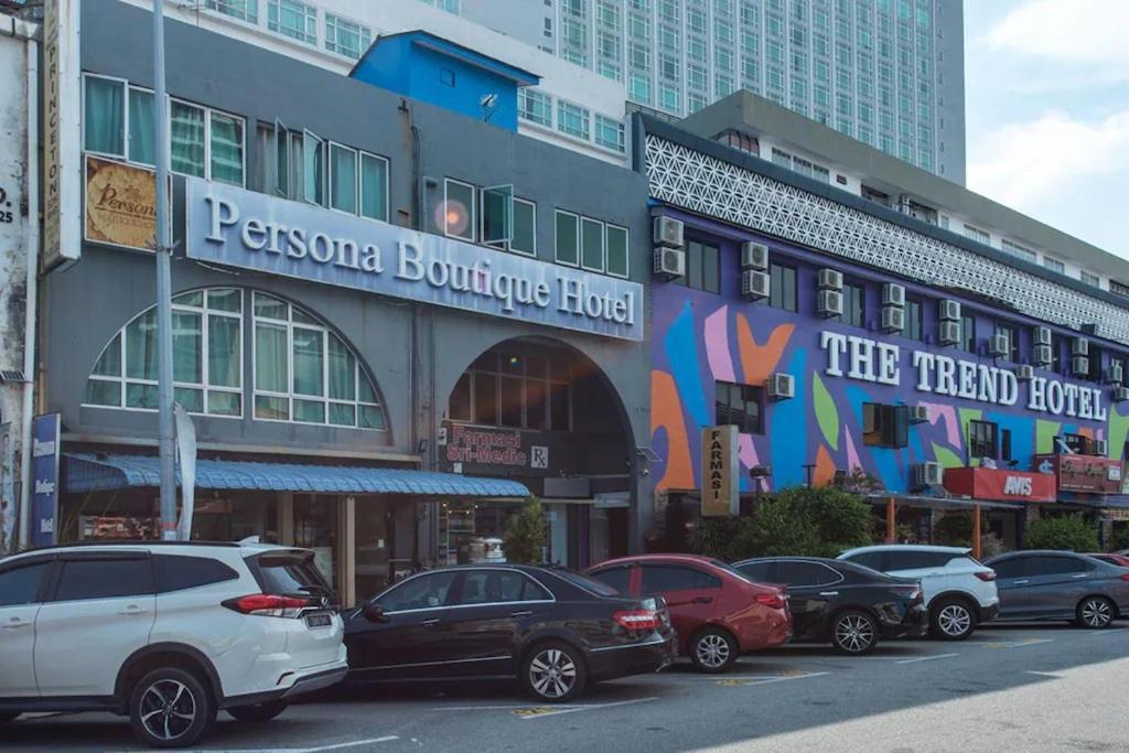 a group of cars parked in front of a building at Persona Boutique Hotel in Malacca
