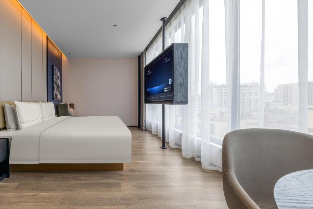 TV a/nebo společenská místnost v ubytování Atour Hotel Shantou Chenghai Guosheng Center