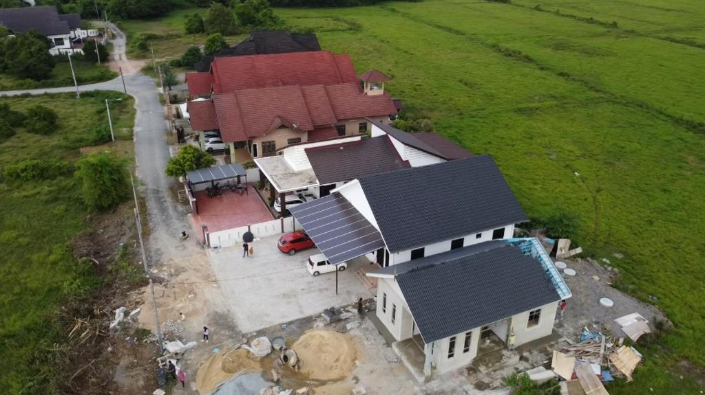an overhead view of a house with solar panels on it at Seri Desa Homestay in Kuala Terengganu